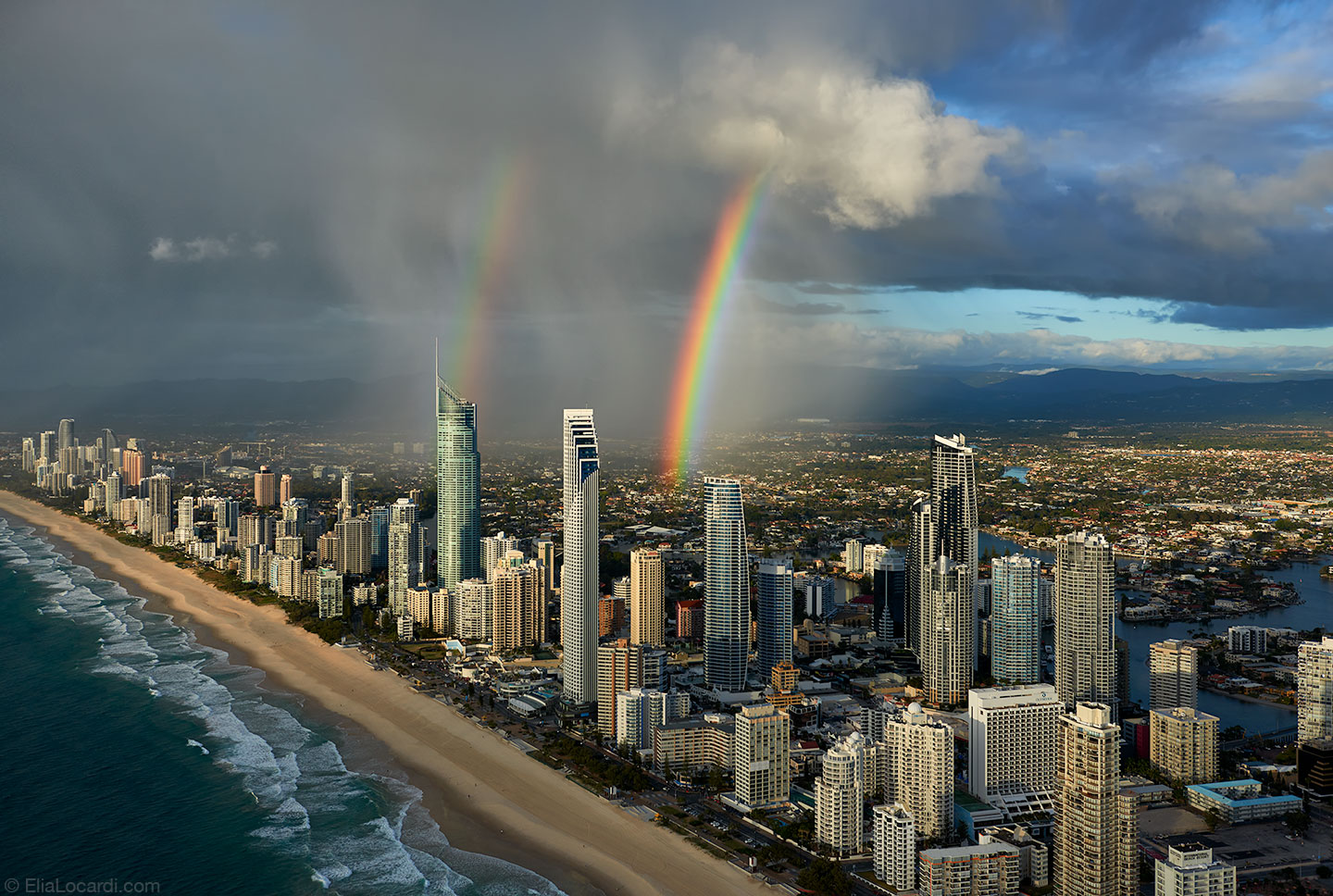 (A double rainbow appears over Surfers Paradise in Queensland Australia.)