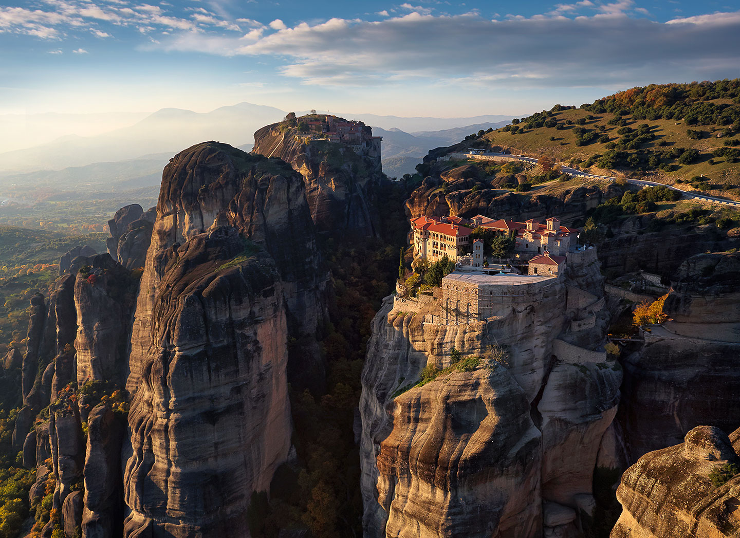(Watching a beautiful sunset high above the monasteries of Meteora Greece.)